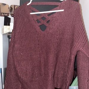 aeropostale sweater with crossings on the back. maroon color and light material.